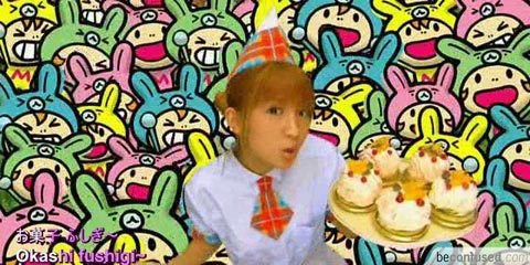 Mari Yaguchi holding a cake or keiki as they call.