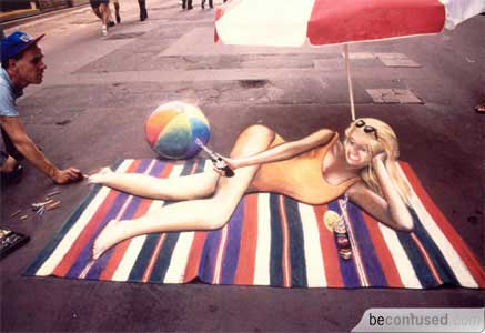 Girl lying on the beach mat.